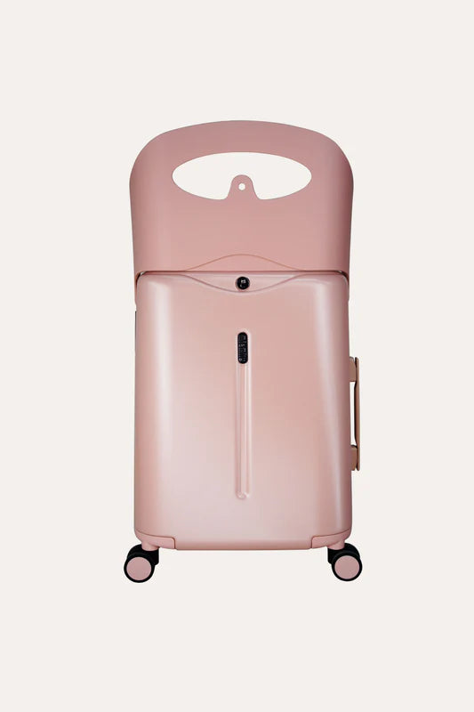 Pink MiaMily carry-on suitcase with wheels and an upright seat-back section.