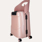 Angled view of the pink MiaMily carry-on suitcase with upright seat back and wheels.