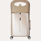 Front view of the champagne-colored MiaMily carry-on suitcase with upright seat back.