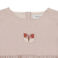 Close-up of the butterfly detail and neckline on the Donsje Vailen playsuit.