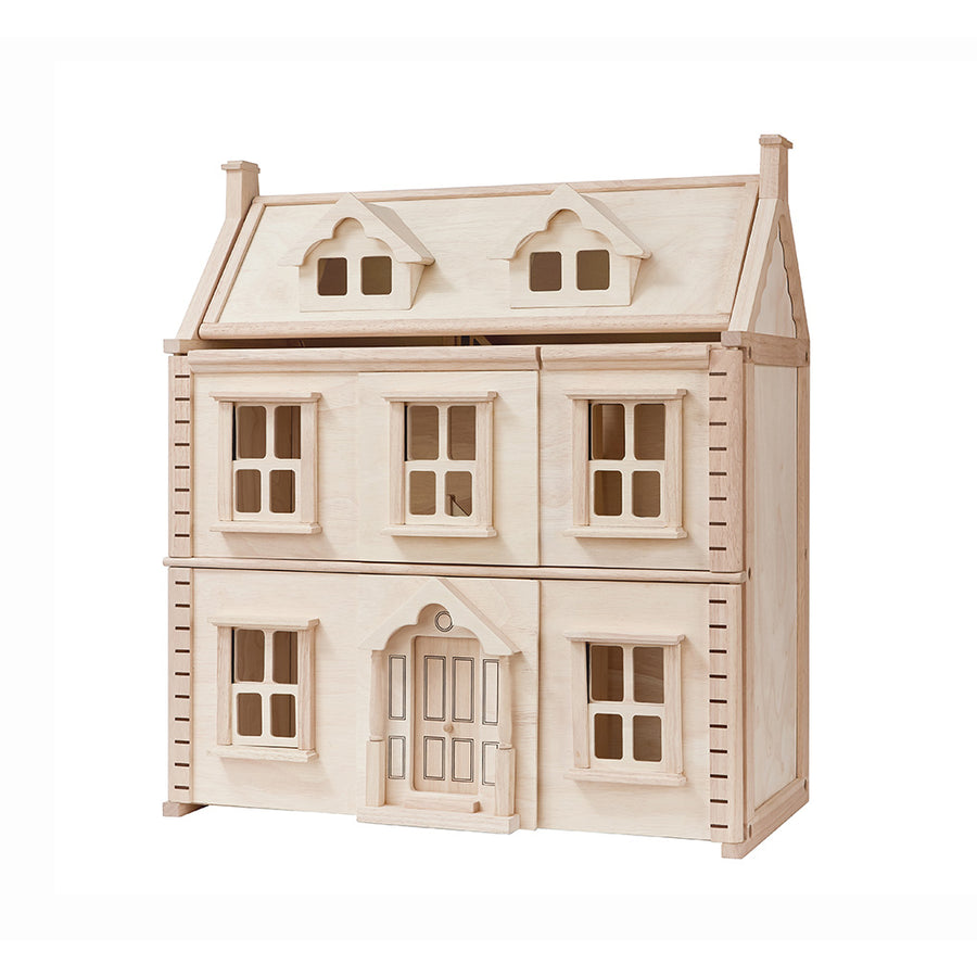 Natural wood PlanToys Victorian dollhouse with shuttered windows and a pitched roof.