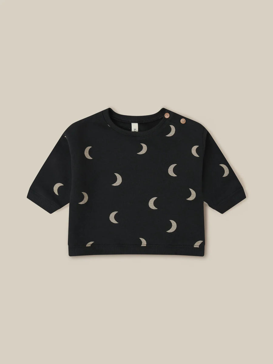 Charcoal Organic Zoo sweatshirt with cream crescent moons and shoulder buttons.