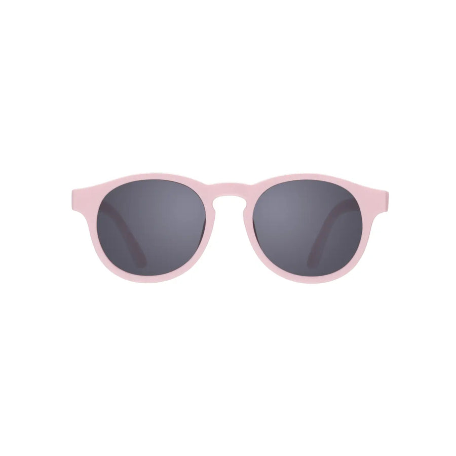Pink Babiators keyhole sunglasses with dark round lenses, front view.