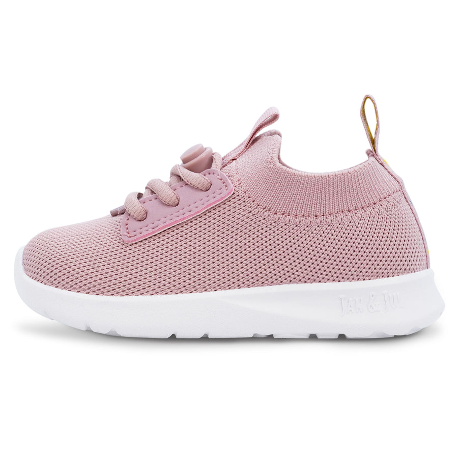 Pink Jan & Jul knit-look shoe with pink laces and a white sole, side view.