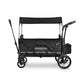 Black WonderFold X2M wagon with canopy and storage bag, side view.