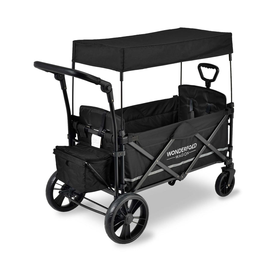 Black WonderFold X2M stroller wagon with a canopy and push handle, angled view.