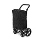 Black WonderFold X2M wagon folded upright beneath a fabric cover.
