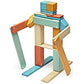 Tegu Sunset blocks arranged into a standing figure with bent arms and wide feet.
