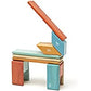 Tegu Sunset blocks arranged into a chair-like structure with an angled back.