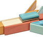 Tegu Sunset blocks arranged into a low, wing-shaped model on a white background.