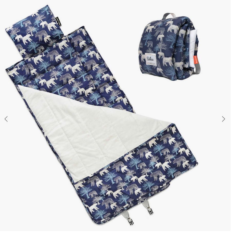 Navy bear-print Urban Infant sleeping mat laid open beside a matching backpack.