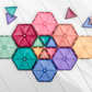 Pastel CONNETIX tiles arranged into a flower-like cluster of colored hexagons.