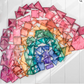 Pastel CONNETIX tiles spread into a rainbow-colored fan on the floor.