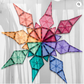 Pastel CONNETIX triangular tiles arranged into a multicolored starburst.