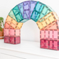 Pastel CONNETIX tiles assembled into a freestanding rainbow arch.