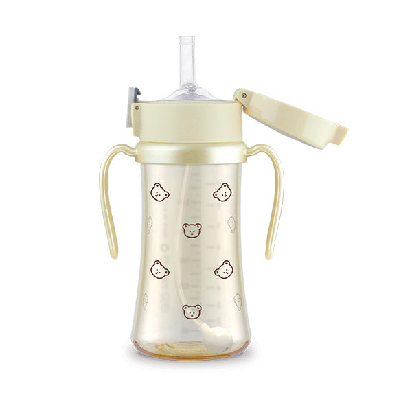 Grosmimi straw cup with pale green handles and lid and small bear illustrations.